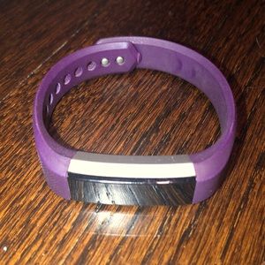 Fitbit Alta purple size S.  Comes with charger.